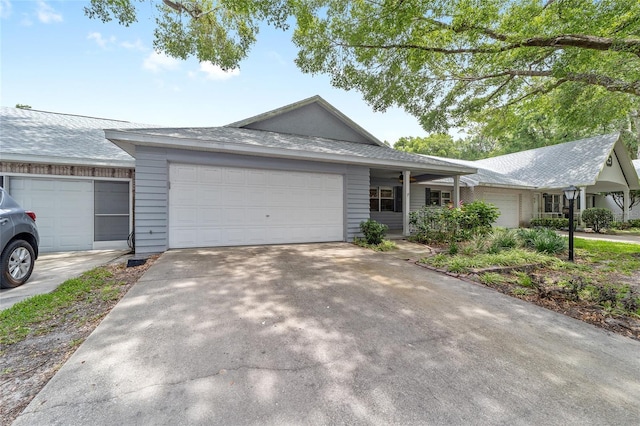 8745 SW 92nd St Unit B, Ocala, FL 34481 - ranch-style house with an attached garage and concrete driveway