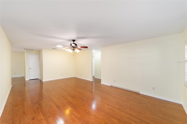 8745 SW 92nd St Unit B, Ocala, FL 34481 - unfurnished room with a ceiling fan, wood finished floors, and baseboards