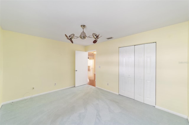 8745 SW 92nd St Unit B, Ocala, FL 34481 - unfurnished bedroom featuring carpet flooring, baseboards, a chandelier, a closet, and ceiling fan
