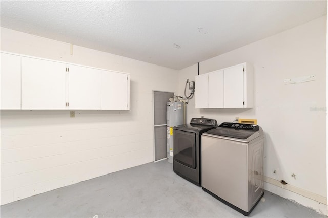 8745 SW 92nd St Unit B, Ocala, FL 34481 - laundry area with electric water heater, washing machine and clothes dryer, and cabinet space