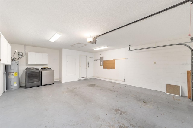 8745 SW 92nd St Unit B, Ocala, FL 34481 - garage featuring water heater, washer and clothes dryer, electric panel, and a garage door opener