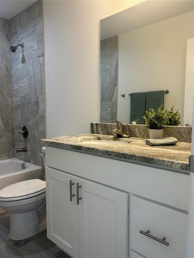 960 NW Redwood Dr, Dunnellon, FL 34431 - bathroom with vanity, toilet, shower / bathtub combination, and wood finished floors