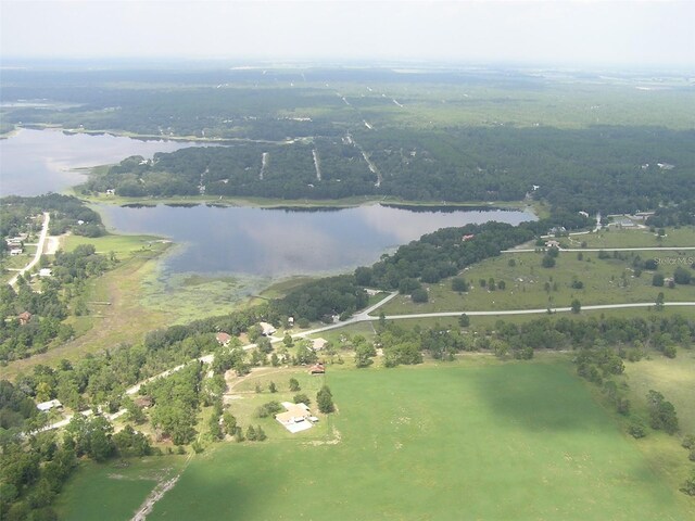 960 NW Redwood Dr, Dunnellon, FL 34431 - view of property location with a nearby body of water, rural landscape, and a heavily wooded area