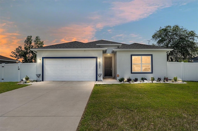14055 SW 30th Terrace Rd, Ocala, FL 34473 - view of front facade featuring concrete driveway, a garage, stucco siding, and a gate