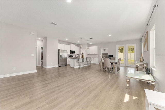 14055 SW 30th Terrace Rd, Ocala, FL 34473 - living room featuring recessed lighting, light wood finished floors, and baseboards