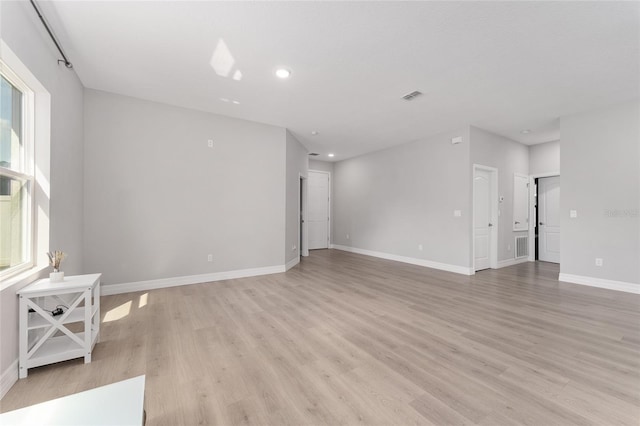 14055 SW 30th Terrace Rd, Ocala, FL 34473 - unfurnished living room with light wood-style flooring, baseboards, and recessed lighting