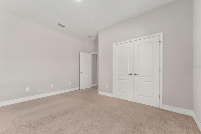 14055 SW 30th Terrace Rd, Ocala, FL 34473 - unfurnished bedroom with carpet floors, baseboards, and a closet