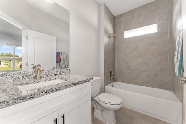 14055 SW 30th Terrace Rd, Ocala, FL 34473 - full bathroom with toilet, vanity, shower / bath combination, and tile patterned flooring