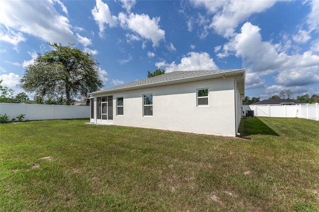 14055 SW 30th Terrace Rd, Ocala, FL 34473 - rear view of house featuring stucco siding, a sunroom, and central air condition unit