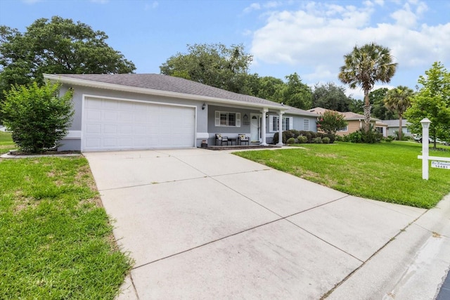 14481 SW 112th Cir, Dunnellon, FL 34432 - single story home with driveway, a garage, a front yard, stucco siding, and covered porch