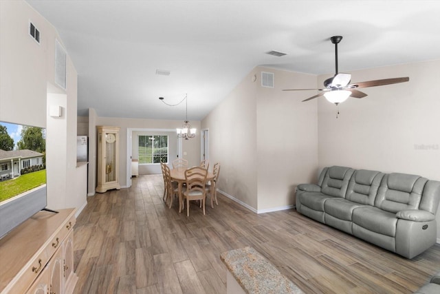 14481 SW 112th Cir, Dunnellon, FL 34432 - living area with light wood-type flooring, a chandelier, a ceiling fan, and baseboards