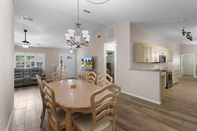 14481 SW 112th Cir, Dunnellon, FL 34432 - dining area featuring light wood-style flooring, a chandelier, a ceiling fan, lofted ceiling, and baseboards