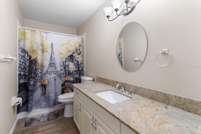 14481 SW 112th Cir, Dunnellon, FL 34432 - full bathroom with toilet, vanity, wood finished floors, a shower with shower curtain, and a chandelier