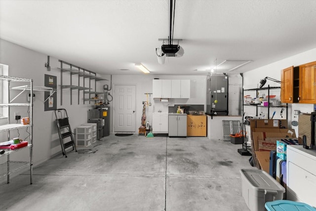 14481 SW 112th Cir, Dunnellon, FL 34432 - garage featuring heating unit, a garage door opener, and electric water heater