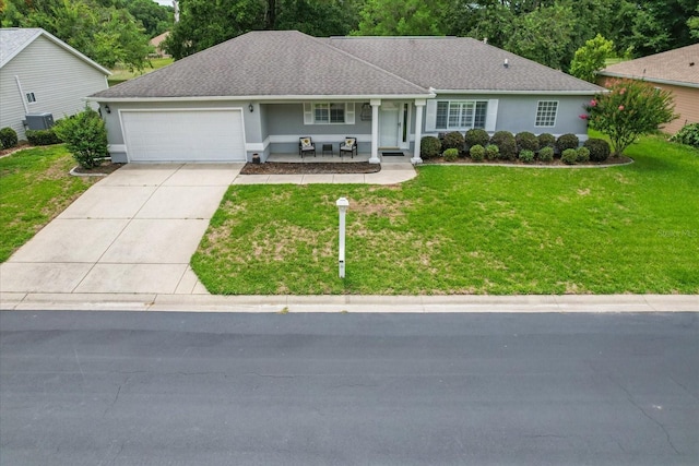 14481 SW 112th Cir, Dunnellon, FL 34432 - ranch-style house featuring covered porch, a garage, driveway, and a front lawn