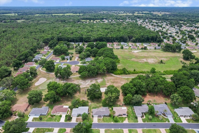 14481 SW 112th Cir, Dunnellon, FL 34432 - aerial view of property and surrounding area featuring nearby suburban area and a heavily wooded area