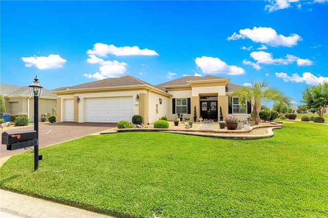 11871 SE 91st Cir, Summerfield, FL 34491 - view of front facade with driveway, stucco siding, a garage, and a front yard