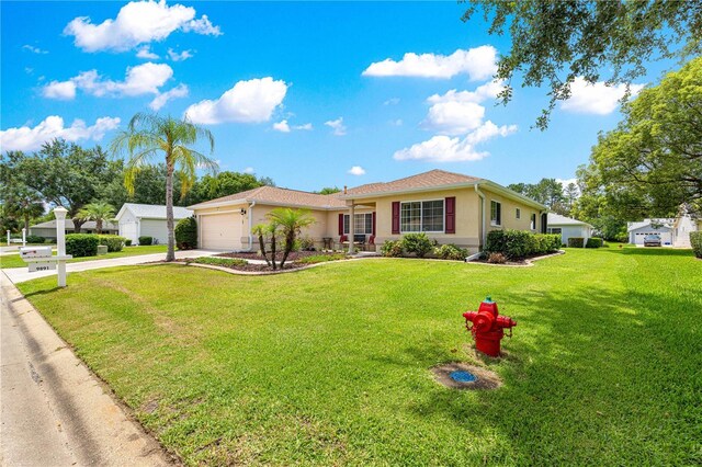 9891 SE 138th Loop, Summerfield, FL 34491 - ranch-style house with driveway, stucco siding, an attached garage, and a front lawn