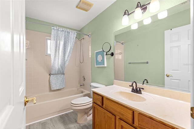 9891 SE 138th Loop, Summerfield, FL 34491 - bathroom featuring tub / shower combination, toilet, vanity, and wood finished floors
