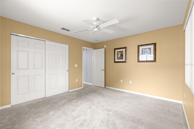 9891 SE 138th Loop, Summerfield, FL 34491 - unfurnished bedroom featuring carpet flooring, a closet, and baseboards