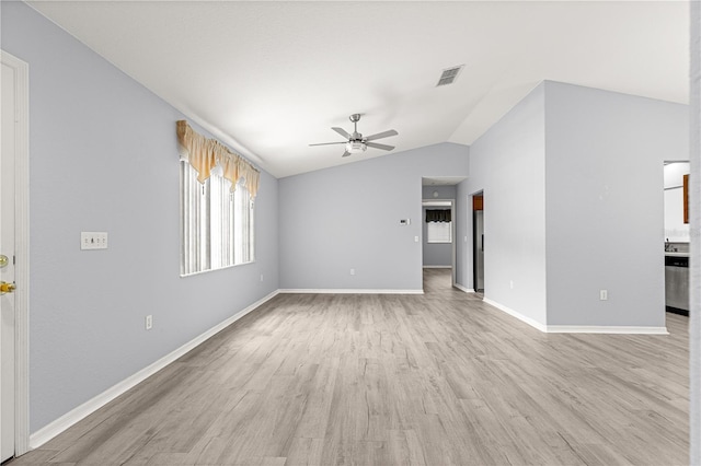 9891 SE 138th Loop, Summerfield, FL 34491 - unfurnished living room with ceiling fan, vaulted ceiling, light wood-type flooring, and baseboards