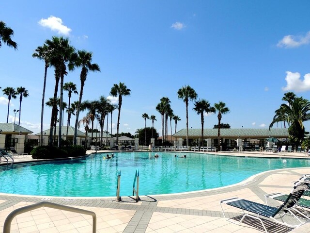 9891 SE 138th Loop, Summerfield, FL 34491 - community pool with a patio