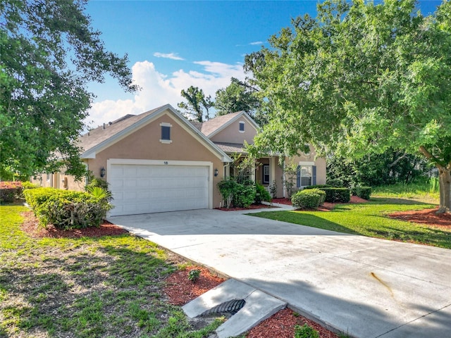 16 Ryewood Cir, Homosassa, FL 34446 - view of front of house featuring stucco siding, an attached garage, and concrete driveway