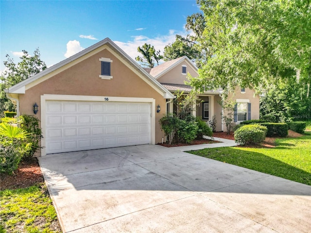 16 Ryewood Cir, Homosassa, FL 34446 - view of front of house with stucco siding, driveway, and a garage