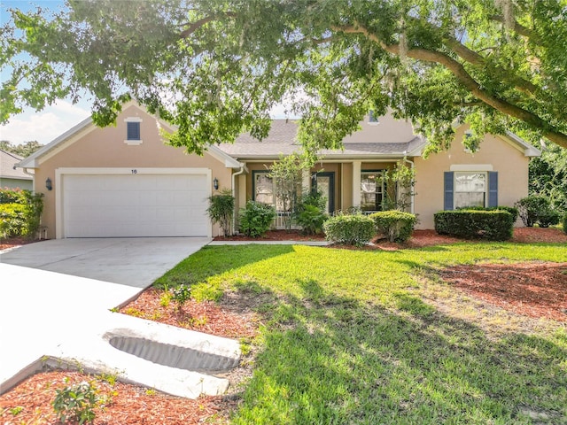 16 Ryewood Cir, Homosassa, FL 34446 - view of front of property with an attached garage, concrete driveway, stucco siding, and a front yard