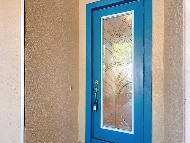 16 Ryewood Cir, Homosassa, FL 34446 - view of exterior entry with stucco siding