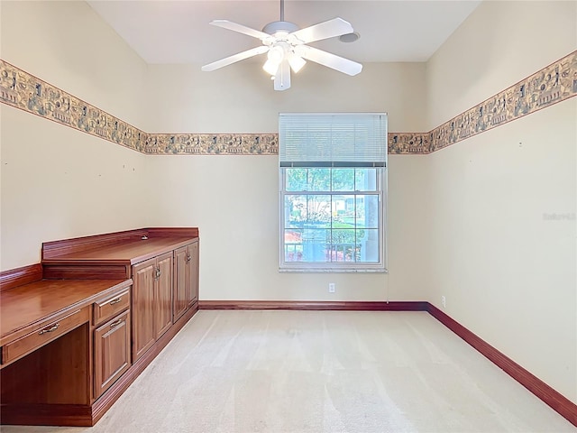 16 Ryewood Cir, Homosassa, FL 34446 - empty room with a ceiling fan, light carpet, and baseboards