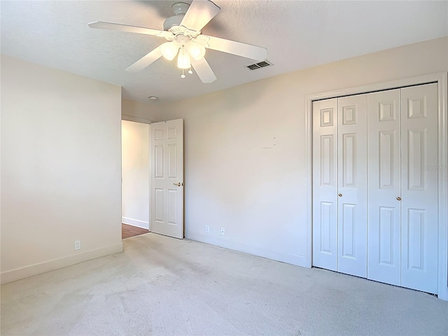 16 Ryewood Cir, Homosassa, FL 34446 - unfurnished bedroom with carpet, baseboards, a closet, and ceiling fan