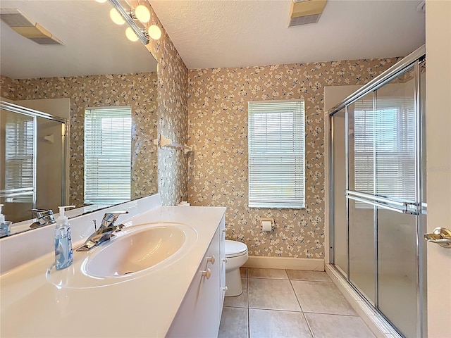 16 Ryewood Cir, Homosassa, FL 34446 - bathroom with tile patterned floors, toilet, vanity, a stall shower, and wallpapered walls