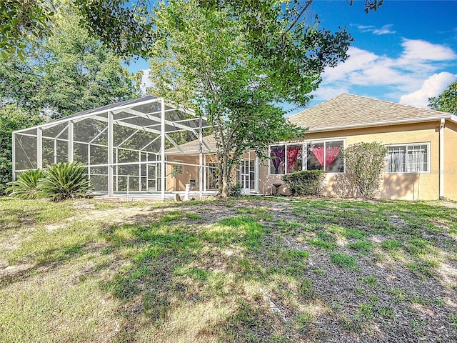 16 Ryewood Cir, Homosassa, FL 34446 - rear view of house with stucco siding and a lanai
