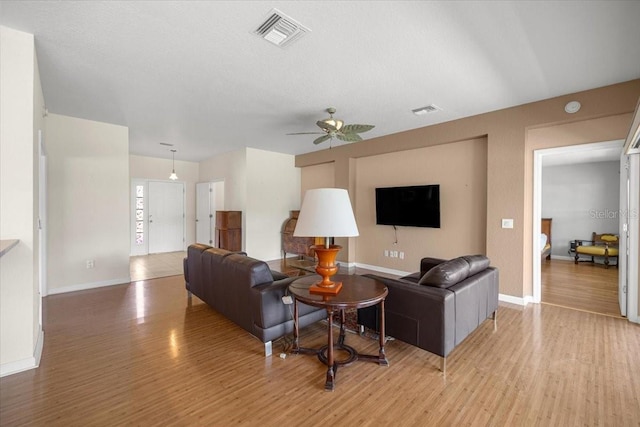 4225 SW 57th Ave, Ocala, FL 34474 - living area featuring light wood-style flooring, ceiling fan, and baseboards