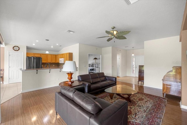 4225 SW 57th Ave, Ocala, FL 34474 - living area with a ceiling fan, light wood-style floors, baseboards, and recessed lighting