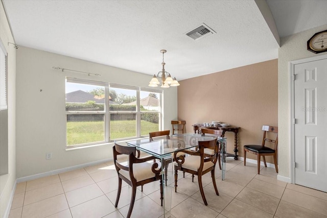 4225 SW 57th Ave, Ocala, FL 34474 - dining room with a chandelier, light tile patterned floors, and baseboards