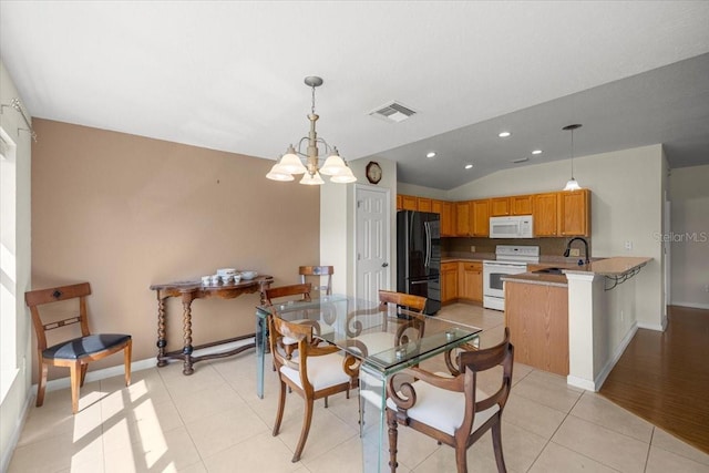4225 SW 57th Ave, Ocala, FL 34474 - dining space with a chandelier, lofted ceiling, baseboards, recessed lighting, and light tile patterned floors