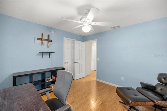 4225 SW 57th Ave, Ocala, FL 34474 - home office featuring ceiling fan, light wood-style floors, and baseboards