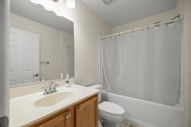 4225 SW 57th Ave, Ocala, FL 34474 - bathroom with a textured wall, vanity, toilet, and shower / tub combo