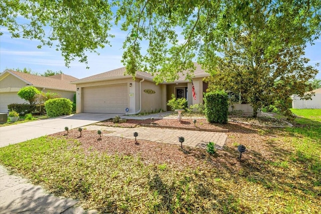 4225 SW 57th Ave, Ocala, FL 34474 - single story home with concrete driveway, a garage, and stucco siding