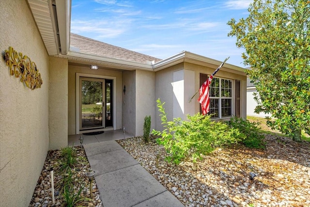 4225 SW 57th Ave, Ocala, FL 34474 - entrance to property featuring stucco siding and a shingled roof