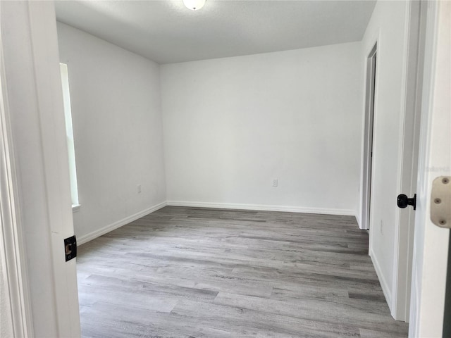 541 56th Ct, Ocala, FL 34482 - spare room featuring wood finished floors and baseboards