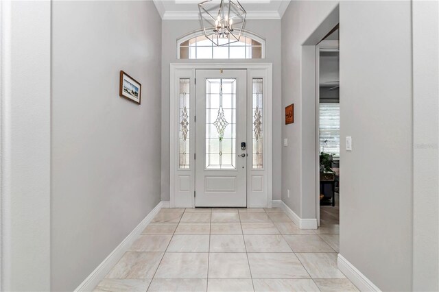 7210 SW 179th Ct, Dunnellon, FL 34432 - entrance foyer featuring ornamental molding, a chandelier, and baseboards