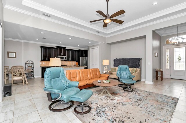 7210 SW 179th Ct, Dunnellon, FL 34432 - living room featuring a ceiling fan, recessed lighting, crown molding, a chandelier, and light tile patterned flooring
