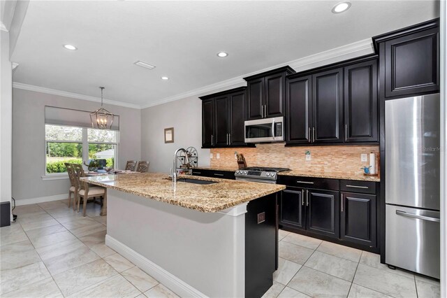7210 SW 179th Ct, Dunnellon, FL 34432 - kitchen with appliances with stainless steel finishes, a sink, dark cabinets, decorative backsplash, and ornamental molding