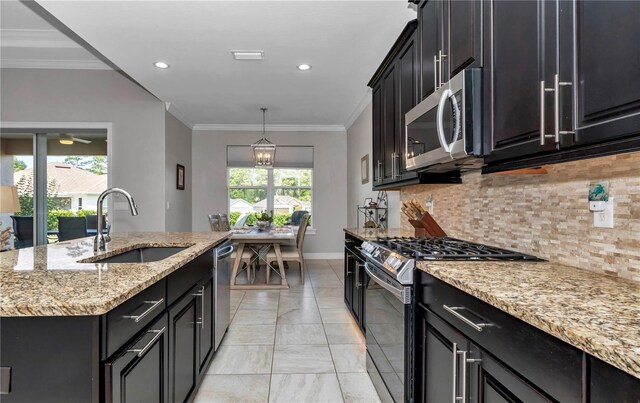 7210 SW 179th Ct, Dunnellon, FL 34432 - kitchen with stainless steel appliances, a sink, light marble finish flooring, tasteful backsplash, and light stone countertops