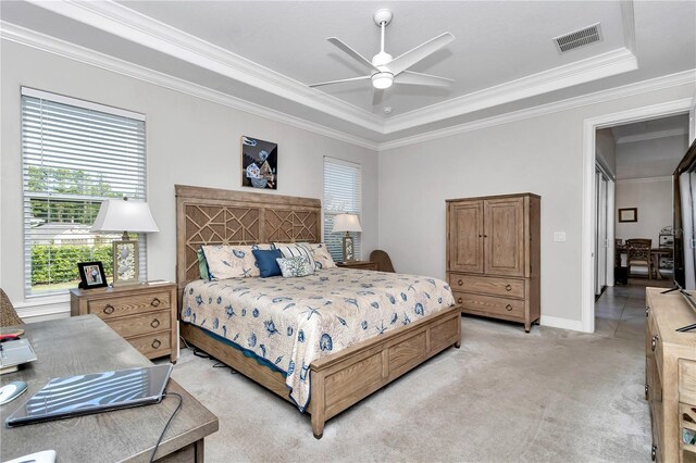 7210 SW 179th Ct, Dunnellon, FL 34432 - bedroom with a tray ceiling, crown molding, light colored carpet, baseboards, and a ceiling fan