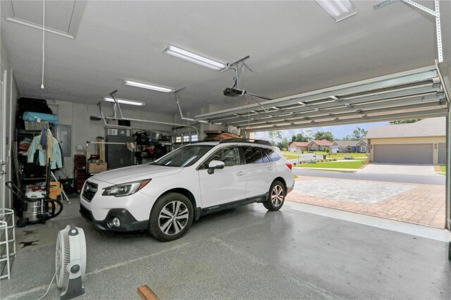 7210 SW 179th Ct, Dunnellon, FL 34432 - garage with a garage door opener and electric panel