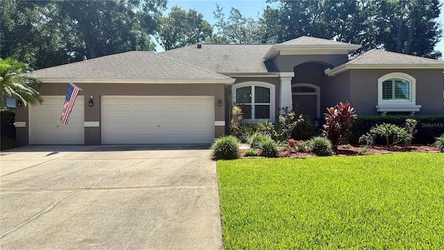 1138 Lumsden Trace Cir, Valrico, FL 33594 - view of front facade featuring concrete driveway, a garage, a front lawn, stucco siding, and a shingled roof